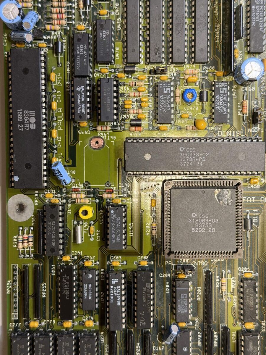 The same board after repair, cleaned, with the battery removed and new sockets and chips fitted